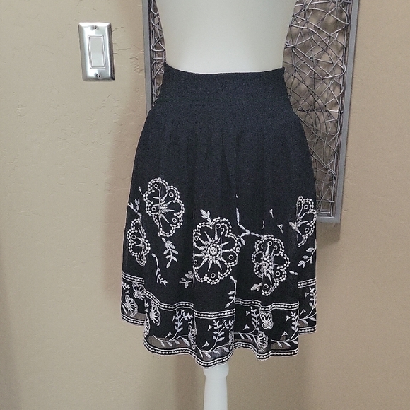 White House Black Market Dresses & Skirts - White House Black Market Black Skirt with Embroidered White Floral Design